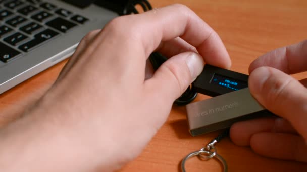 Entering secure PIN code on Bitcoin cryptocurrency cold hardware wallet and accessing funds — Stock Video