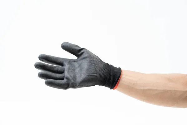 Mano de hombre con guantes antideslizantes negros sobre fondo blanco — Foto de Stock