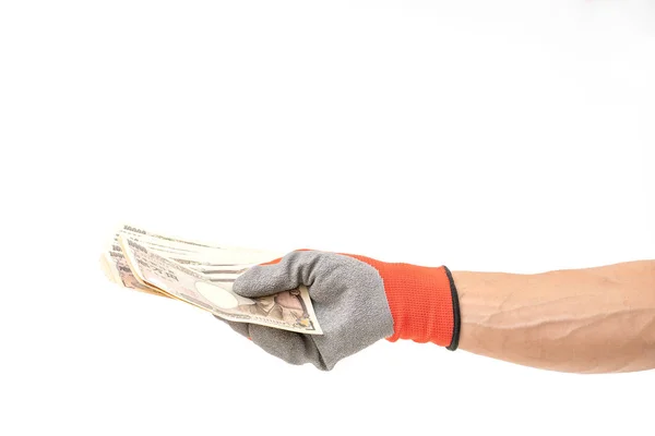 白いバックグローに1万円を持った手袋を持った男の手 — ストック写真