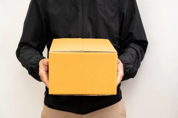 Unrecognized man delivery box of parcel