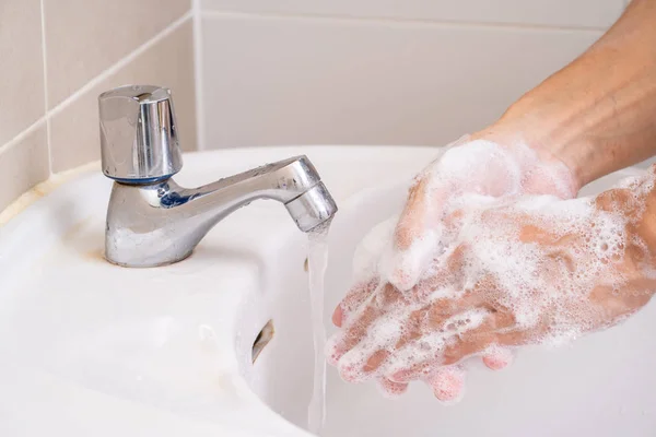 Hand washing with soap foam Stock Photo