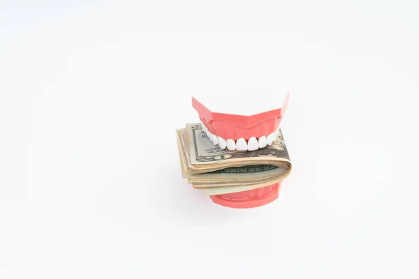 Modelo dental con dólar estadounidense —  Fotos de Stock