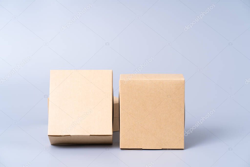 Brown paper box for food package. carton on a gray background.