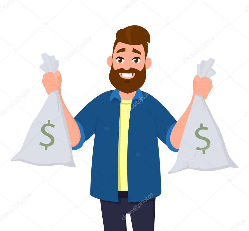 Young man is holding  cash bags in hands. Man showing money bags.