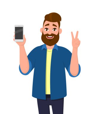 Mutlu genç adam gösteren smartphone ve gösteren zafer, V veya iki (2) oturum açın. Cep telefonu teknoloji kavramı. Vektör çizim karikatür tarzı.