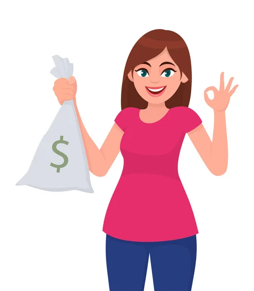 Mladá žena držící / ukazující hotovost, peníze, tašku na bankovky s dolarovou cedulí a gesty nebo ukazující, že je v pořádku / Ok znamení s ručními prsty. Moderní životní styl, obchodní a finanční koncepce v karikaturním stylu. — Stockový vektor