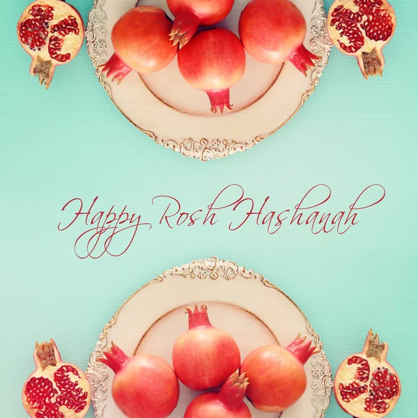 Rosh hashanah (jewish New Year holiday) concept. Pomegranate raditional symbol
