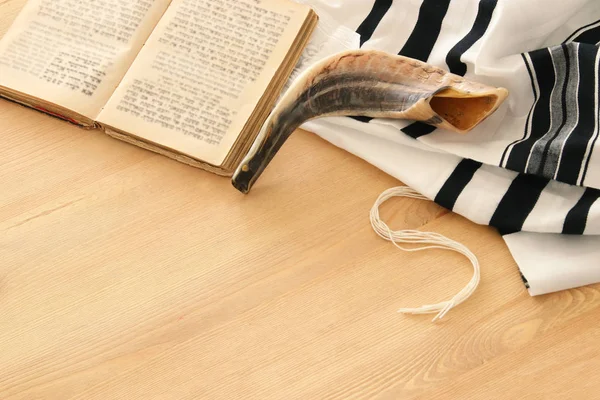 Prayer Shawl - Tallit, Prayer book and Shofar (horn) jewish religious symbols. Rosh hashanah (jewish New Year holiday), Shabbat and Yom kippur concept.