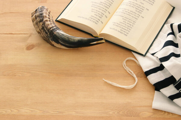 Prayer Shawl - Tallit, Prayer book and Shofar (horn) jewish religious symbols. Rosh hashanah (jewish New Year holiday), Shabbat and Yom kippur concept.