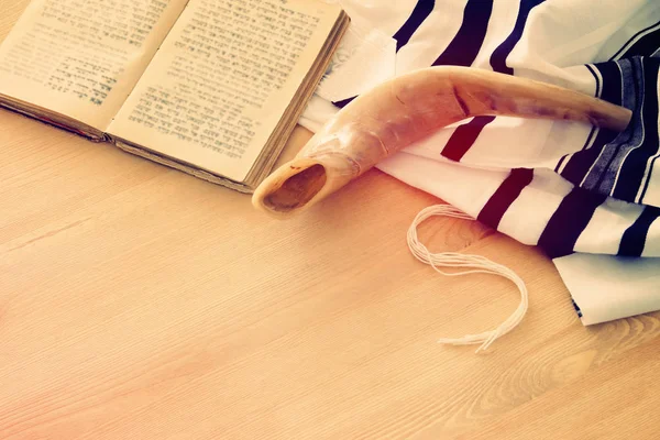 Prayer Shawl - Tallit, Prayer book and Shofar (horn) jewish religious symbols. Rosh hashanah (jewish New Year holiday), Shabbat and Yom kippur concept.