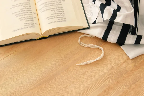 Prayer Shawl - Tallit and Prayer book jewish religious symbols. Rosh hashanah (jewish New Year holiday), Shabbat and Yom kippur concept