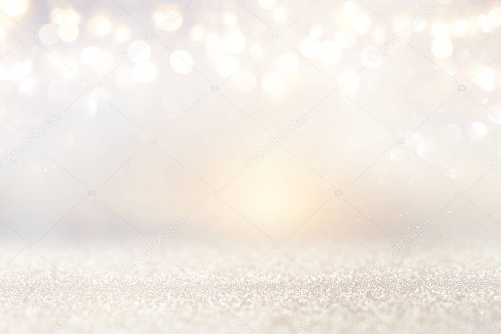 glitter vintage lights background. silver and light gold. de-focused