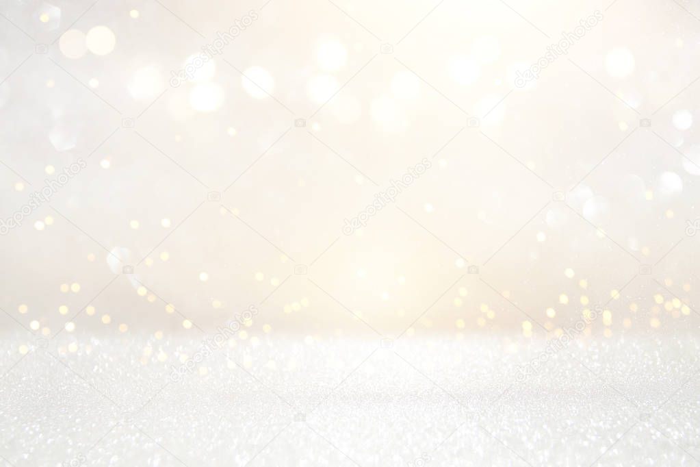 glitter vintage lights background. silver and light gold. de-focused