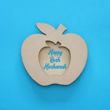 Rosh hashanah (Yahudi yeni yıl tatili) kavramı. Geleneksel sembolü, dekoratif ahşap elma
