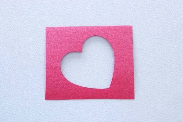 Top view image of heart cutted from pink paper over white background. Health care, donate, world heart day and world health day concept. — Stock Photo, Image