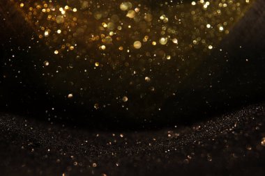 Glitter vintage ışıklar arka plan. siyah ve altın. de-odaklı