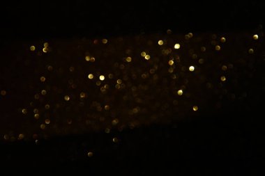 Glitter vintage ışıklar arka plan. siyah ve altın. de-odaklı