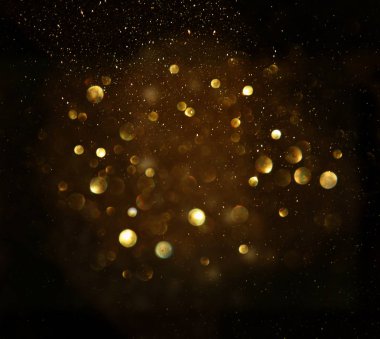 Glitter vintage ışıklar arka plan. siyah ve altın. de-odaklı