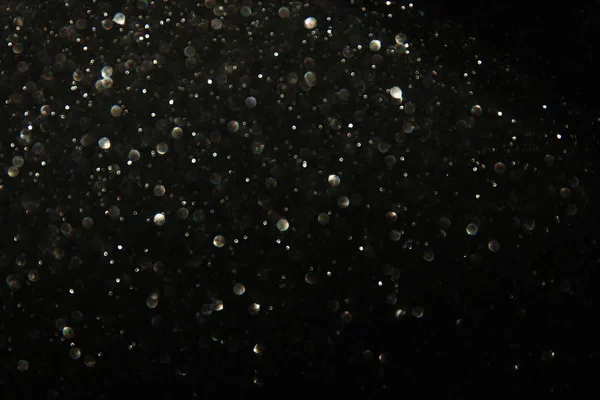 glitter black and silver lights background. de-focused