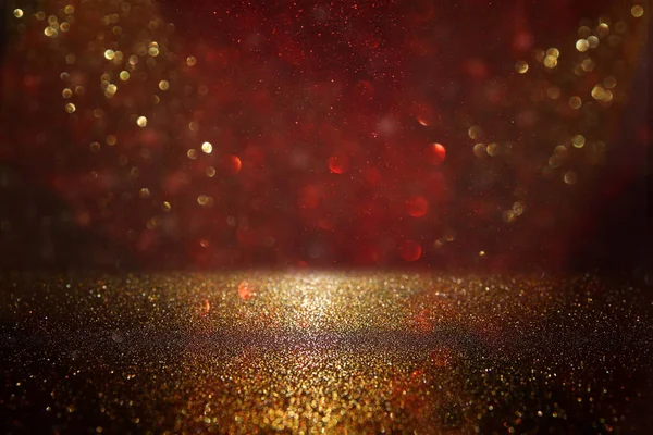 Red, black and gold glitter vintage lights background. defocused