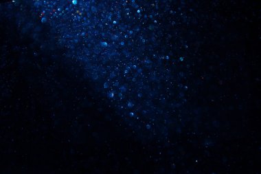 Glitter vintage ışıklar arka plan. siyah ve mavi. de-odaklı