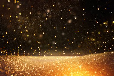 Glitter vintage ışıklar arka plan. siyah ve altın. de-odaklı