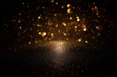 Glitter vintage ışıklar arka plan. siyah ve altın. de-odaklı