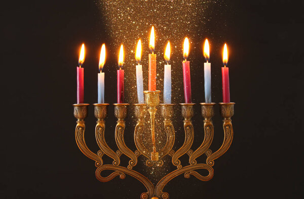 image of jewish holiday Hanukkah background with menorah (traditional candelabra) and candles