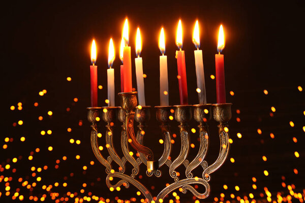 image of jewish holiday Hanukkah background with menorah (traditional candelabra) and candles