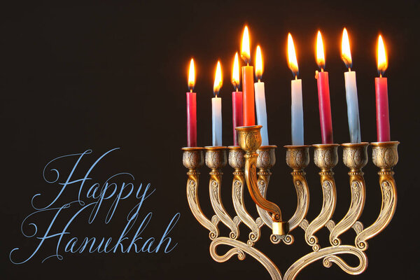 image of jewish holiday Hanukkah background with menorah (traditional candelabra) and candles
