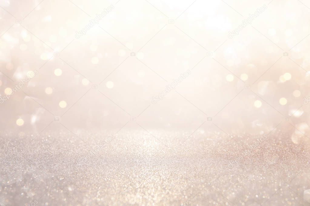 glitter vintage lights background. silver and light gold de-focused