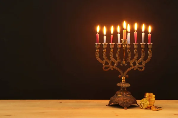 image of jewish holiday Hanukkah background with menorah (traditional candelabra) and candles