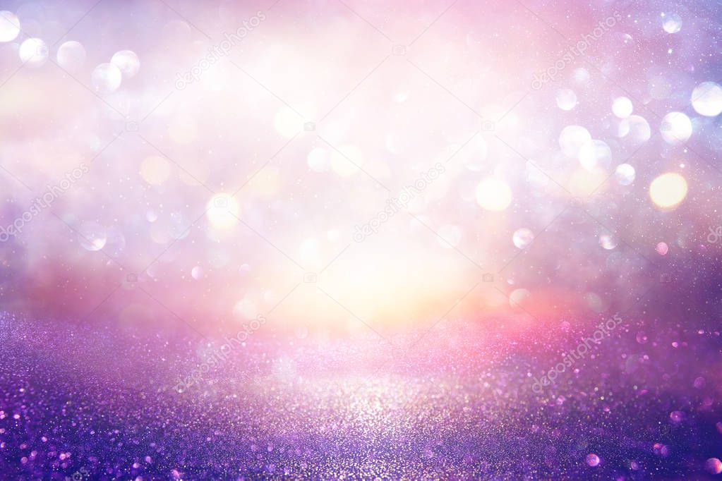 glitter vintage lights background. silver, purple and light gold de-focused