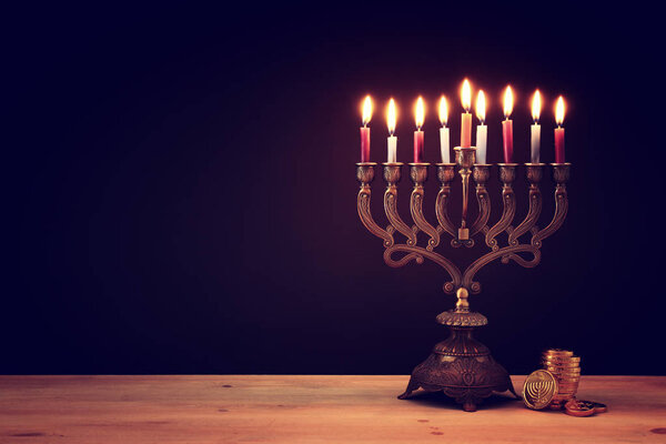 image of jewish holiday Hanukkah background with menorah (traditional candelabra) and candles