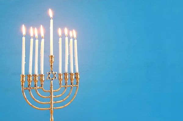 image of jewish holiday Hanukkah background with menorah (traditional candelabra) and candles