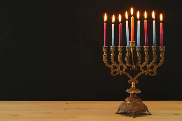 image of jewish holiday Hanukkah background with menorah (traditional candelabra) and candles