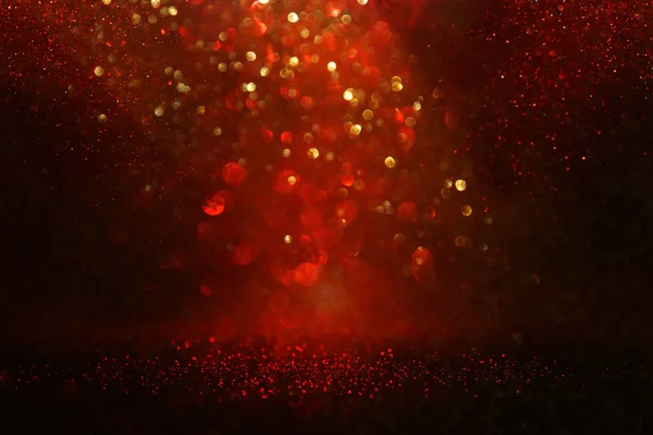 Fond de lumières paillettes rouges, noires et dorées. déconcentré . — Photo