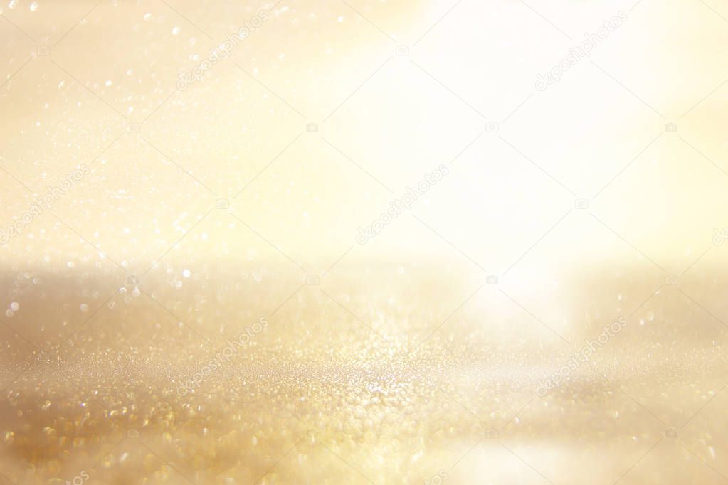 glitter vintage lights background. silver and gold. de-focused