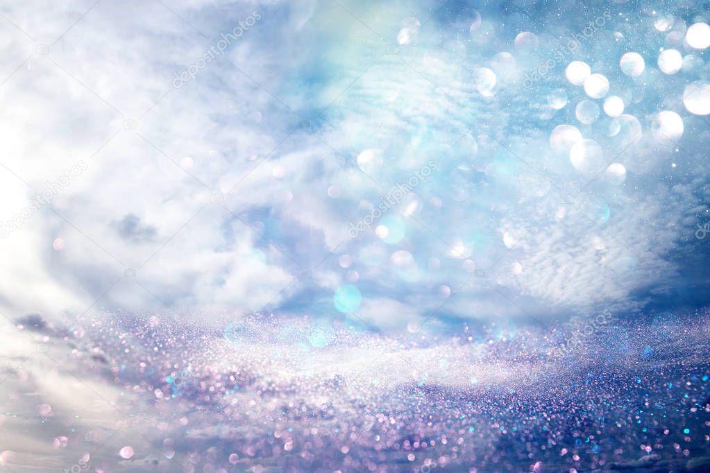 glitter vintage lights background. silver, purple and blue. de-focused