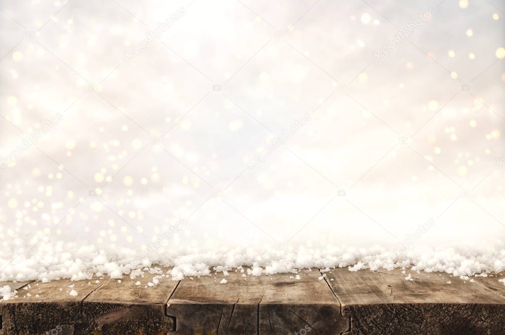 Image of old wooden table in front of glitter lights background. De-focused. Ready for product display montage