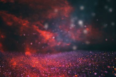 Kırmızı, siyah ve altın ışık arka plan parıltı. defocused