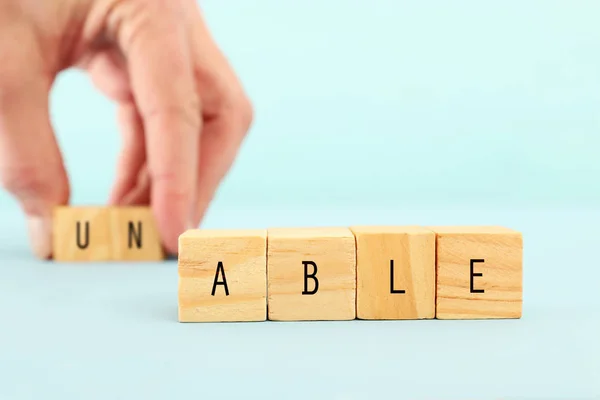 Man Hand Spelling Text Unable Wooden Cubes Taking Out Word — Stock Photo, Image