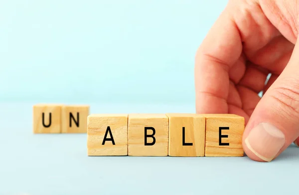 Man Hand Spelling Text Unable Wooden Cubes Taking Out Word — Stock Photo, Image