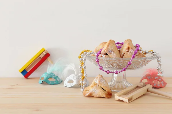 Purim celebration concept (jewish carnival holiday) over wooden table. — Stock Photo, Image