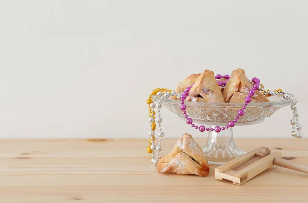 Purim celebration concept (jewish carnival holiday). Traditional hamantaschen cookies over wooden table — Stock Photo, Image