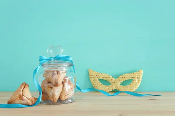 Purim celebration concept (jewish carnival holiday) over wooden table. — Stock Photo, Image