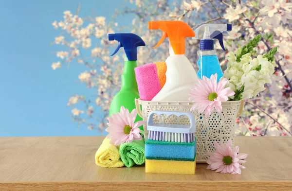 Spring cleaning concept with supplies on wooden table — Stock Photo, Image
