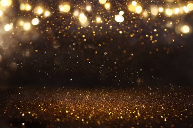 Glitter vintage ışıklar arka plan. siyah ve altın. de-odaklı