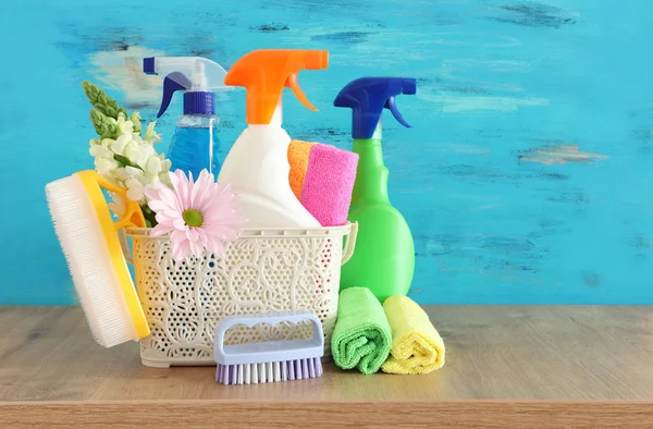 Spring cleaning concept with supplies on wooden table — Stock Photo, Image