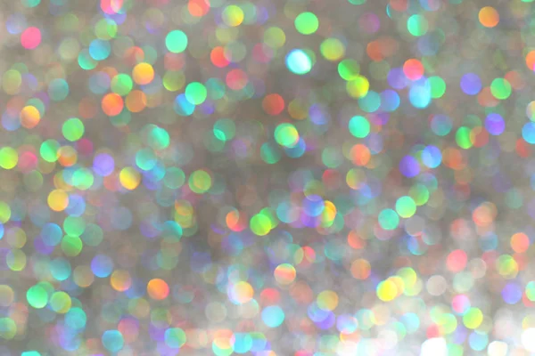 Brilho luzes de prata fundo com bokeh colorido. desfocado — Fotografia de Stock